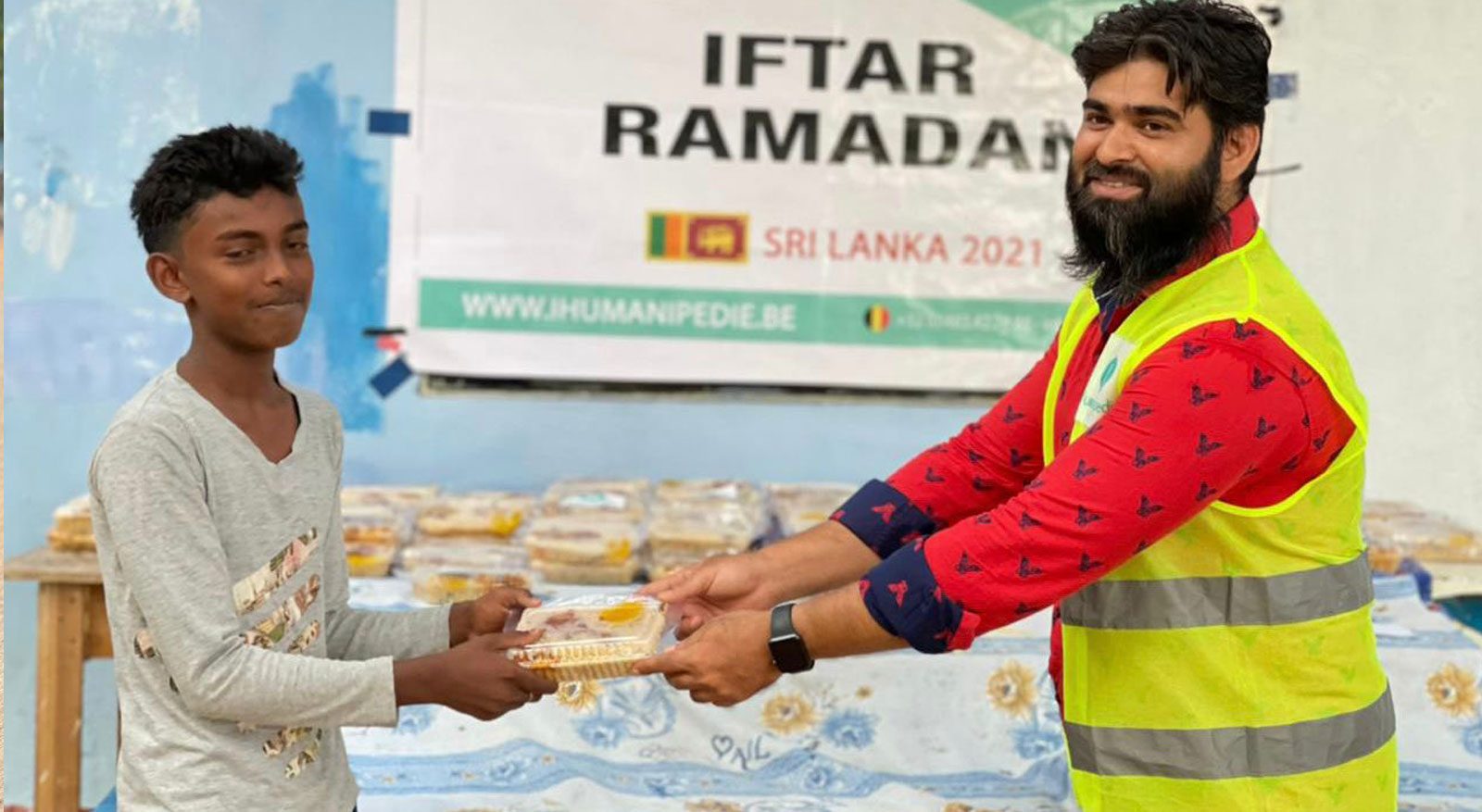 Iftar meal handed to a child during Ramadan